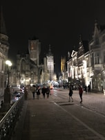 A serene Vienna street scene with travelers walking past historic architecture in the early evening.