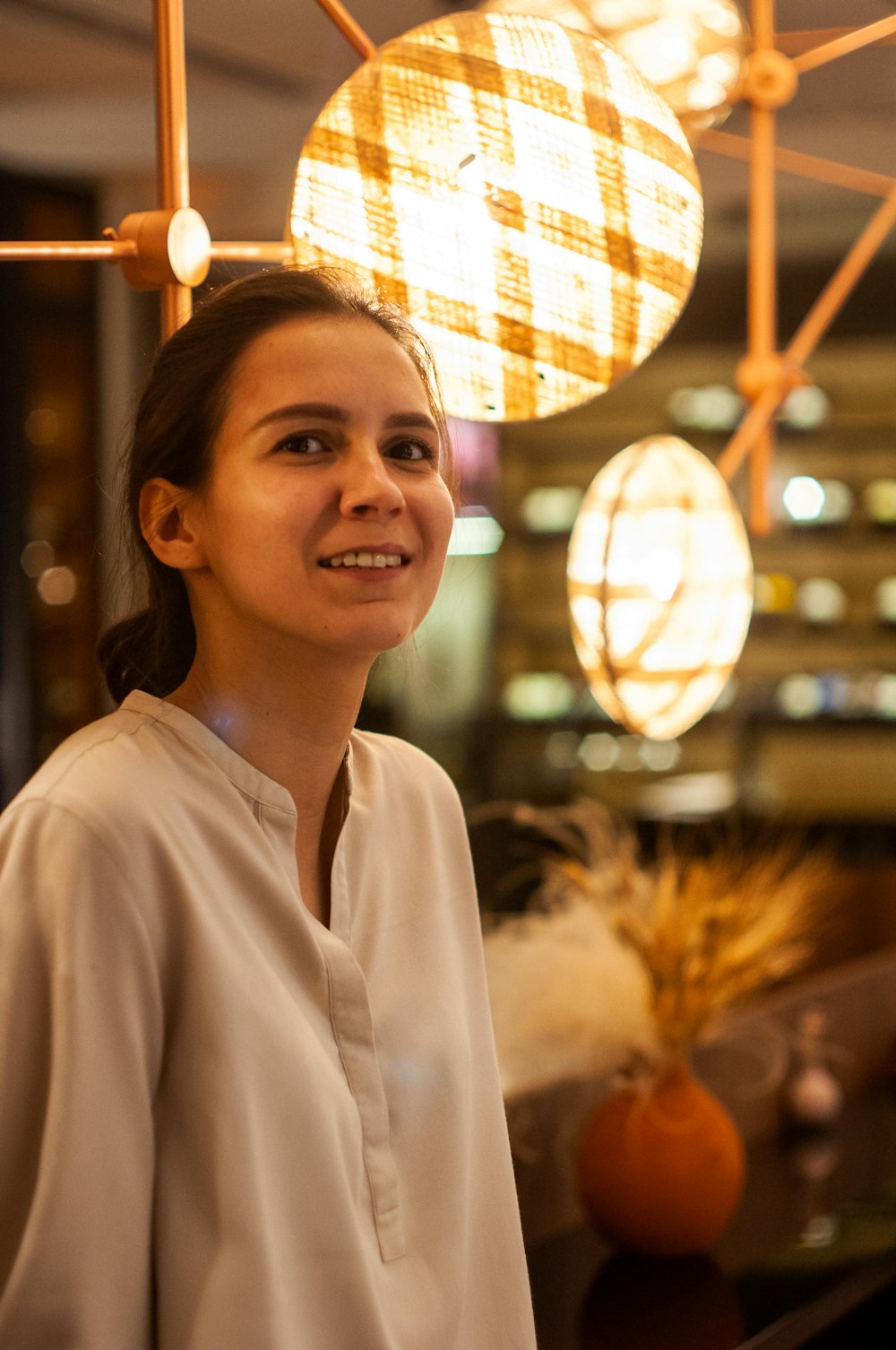 woman in white button up shirt smiling