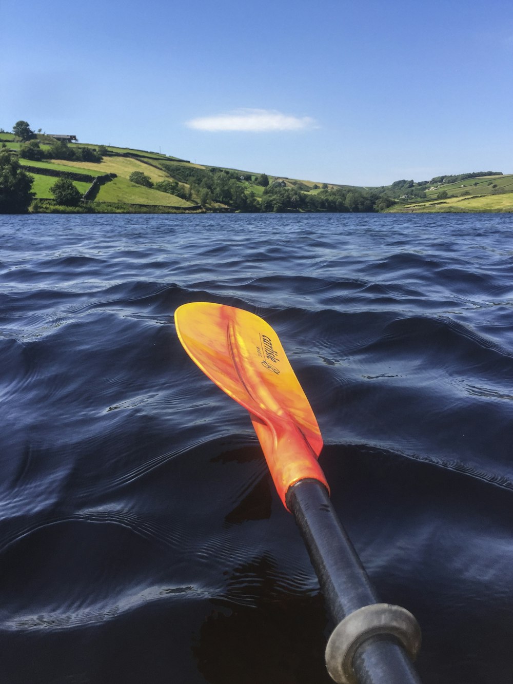 yellow and black kayak on blue sea water during daytime