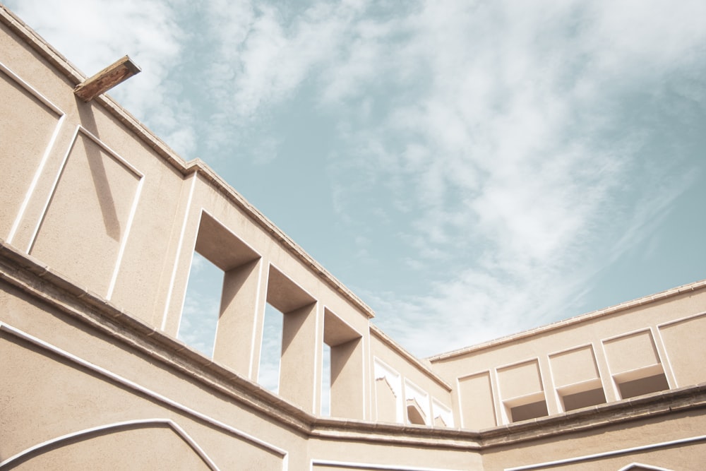 white concrete building under blue sky during daytime