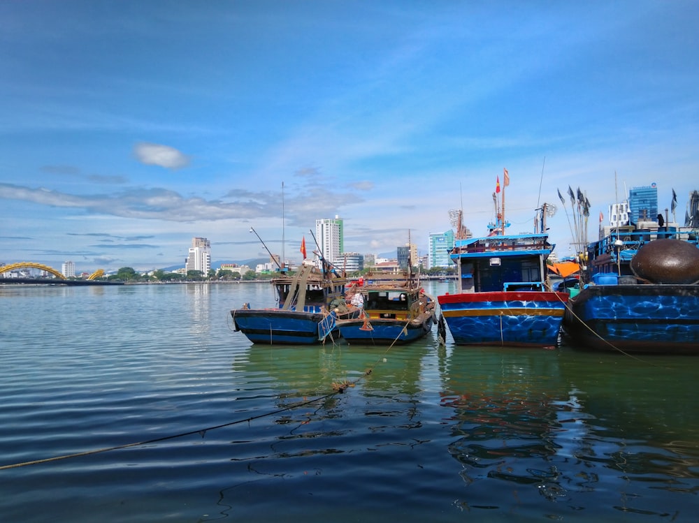 blue and brown boat on sea under blue sky during daytime