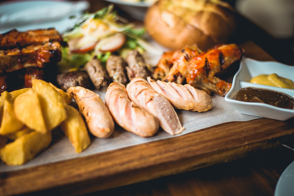 grilled sausage on brown wooden chopping board