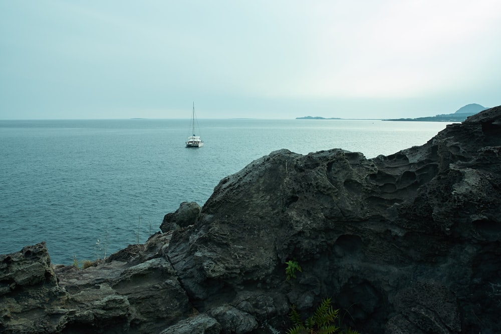 white sailboat on sea during daytime