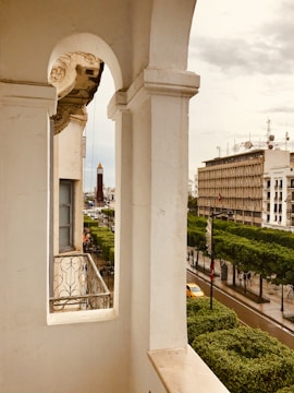 Elegant apartment balcony overlooking city skyline.