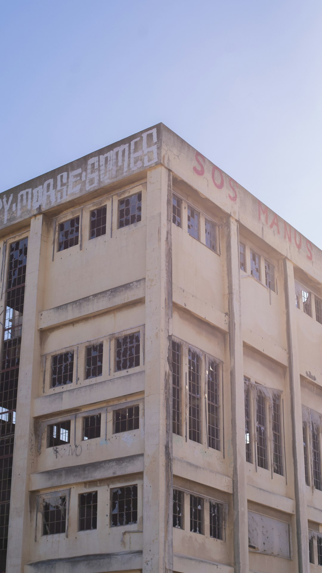 beige concrete building under blue sky during daytime