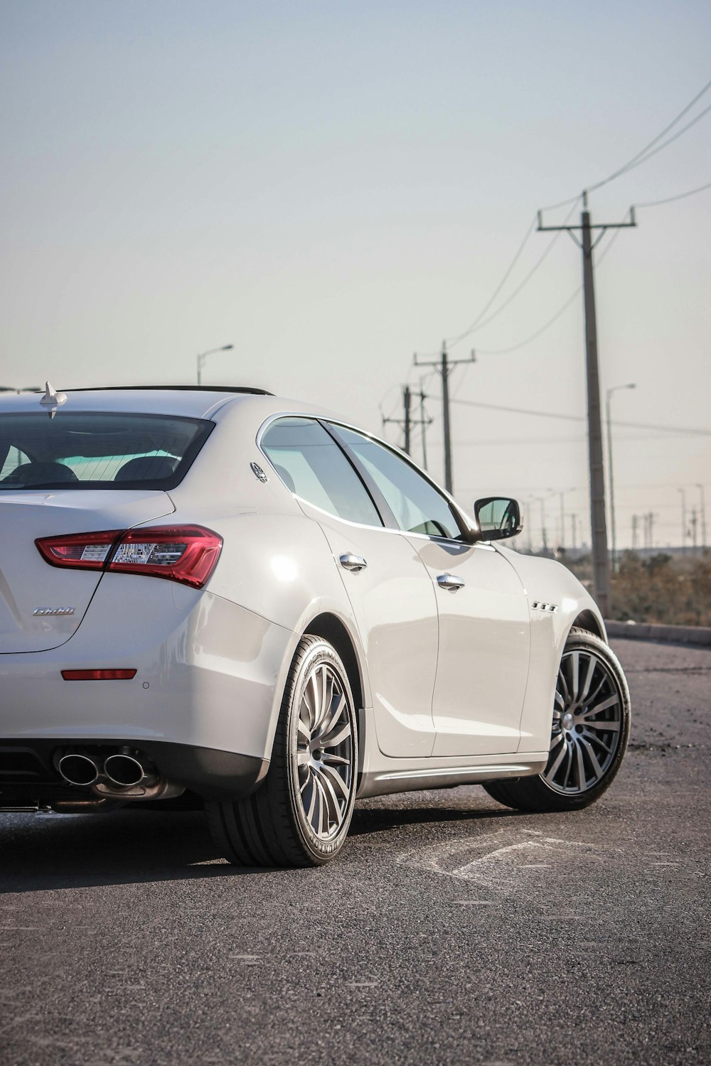 white mercedes benz coupe on road during daytime