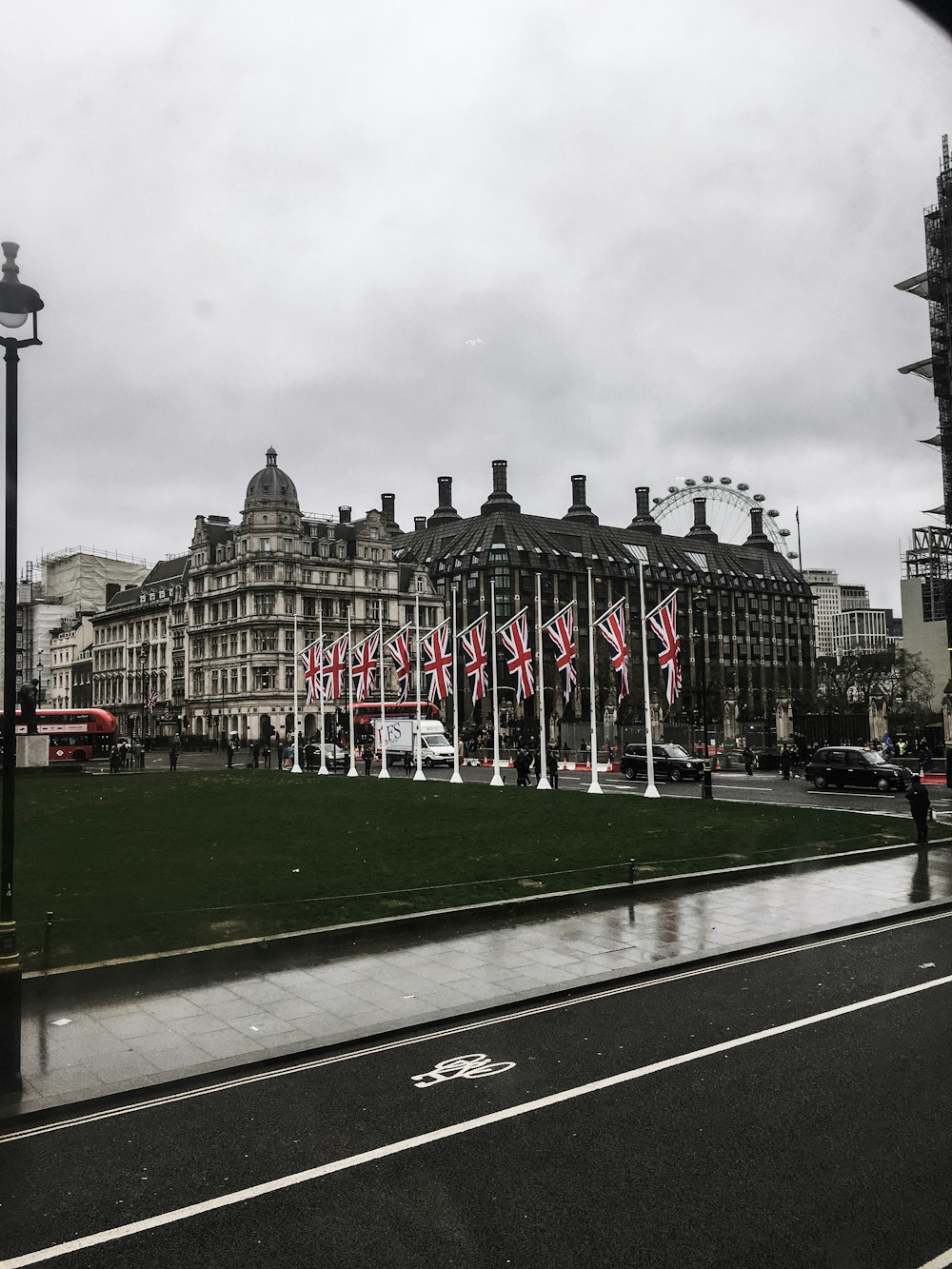 a large building with a lot of flags in front of it