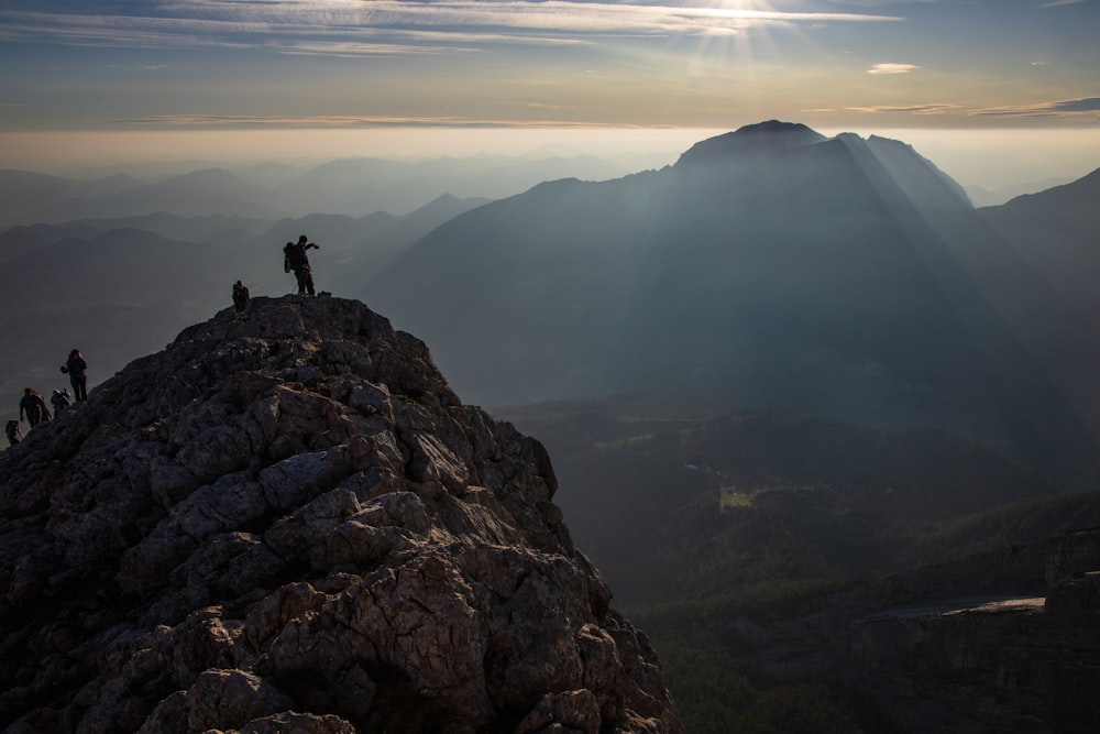 person standing on rock formation during daytime