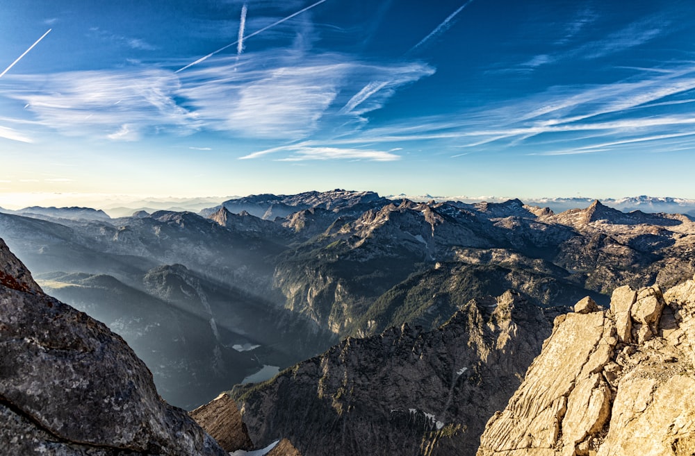 aerial view of mountains under blue sky during daytime