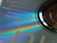 Close-up view of a compact disc with visible rainbow-like reflections and text printed on its surface. The text includes details such as 'Produced by Ed Buller', 'Nude 1992', 'Copyright Control', and 'Stereo'. The disc itself has a shiny, reflective surface with iridescent hues visible around the edges.
