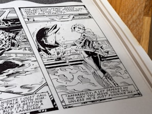 A black and white comic panel showing a person conversing with a dolphin in the water. Dialogue balloons contain text, one of which describes various meanings of the word 'Tikiti', and another commenting on how communication depends on the movement of a tail. The setting suggests an interaction involving communication with animals, probably in the context of understanding or language exploration.