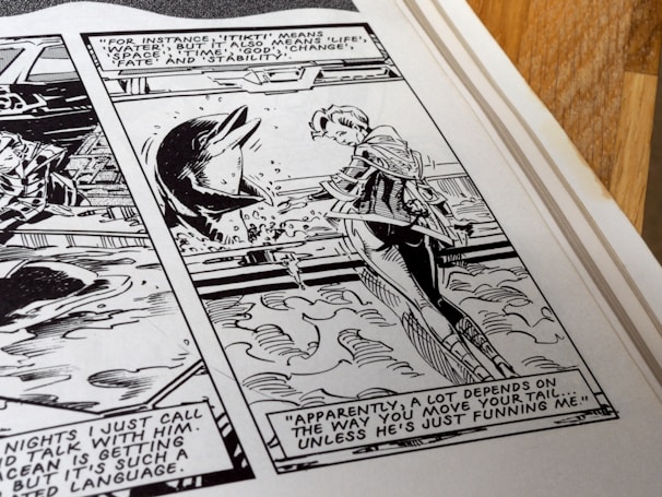 A black and white comic panel showing a person conversing with a dolphin in the water. Dialogue balloons contain text, one of which describes various meanings of the word 'Tikiti', and another commenting on how communication depends on the movement of a tail. The setting suggests an interaction involving communication with animals, probably in the context of understanding or language exploration.