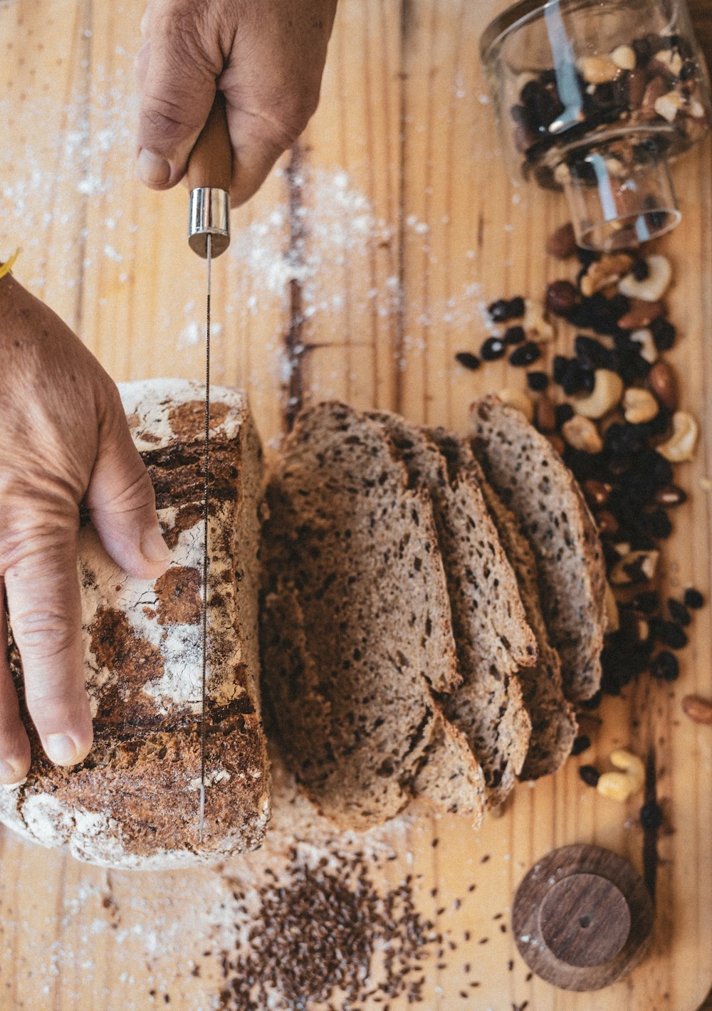 person holding brown and black coffee beans