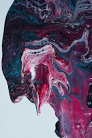 An expressive painting with swirling violet and pink strokes, capturing the essence of healing through creativity.