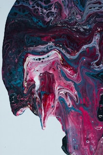 An expressive painting with swirling violet and pink strokes, capturing the essence of healing through creativity.