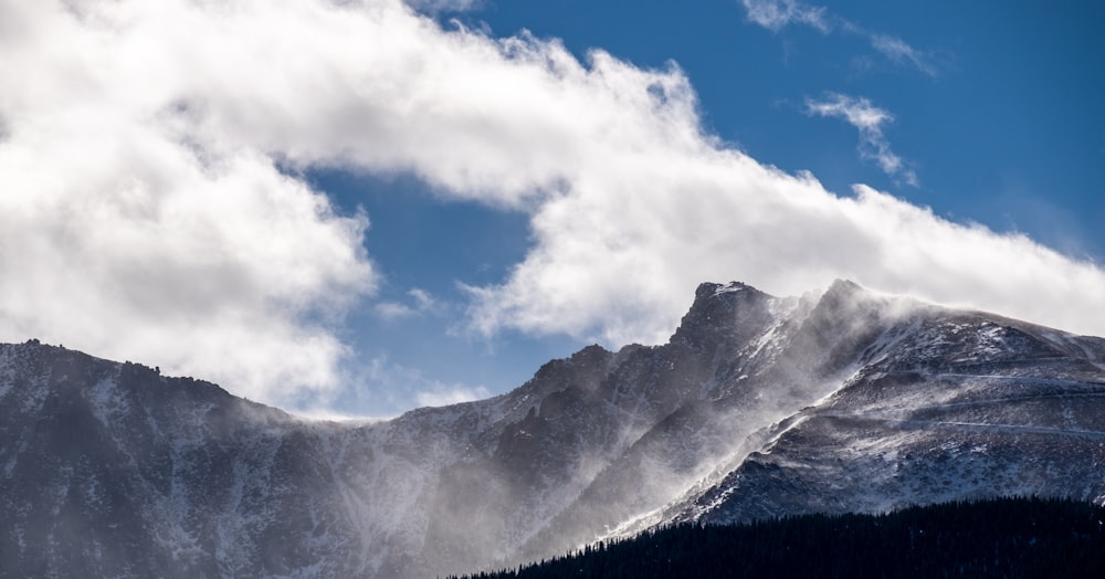 snow covered mountain under blue sky during daytime