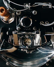 Close-up of a modern coffee dryer machine with steam and cooling elements visible.