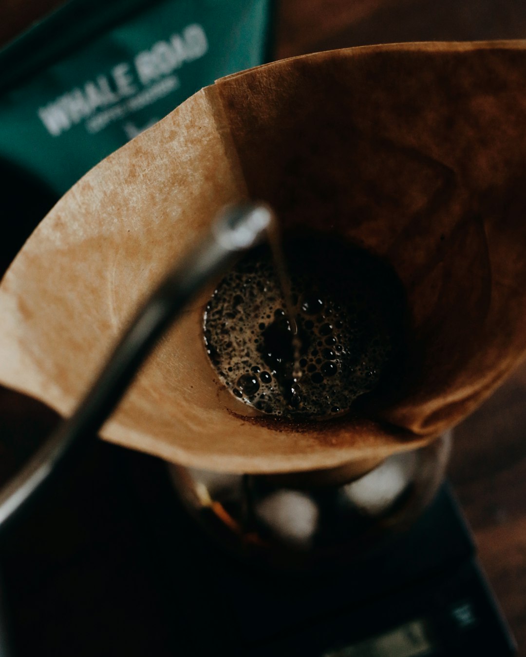 stainless steel spoon on brown paper