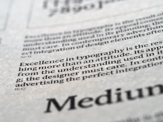 A softly lit workspace with elegant typography on a warm neutral background, highlighting the words 'Integrity & Excellence'.