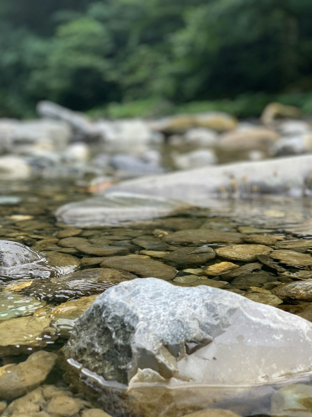 gray rocks on river during daytime