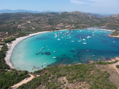 Aerial view of Huatulco’s bays with boats dotting the sparkling sea.