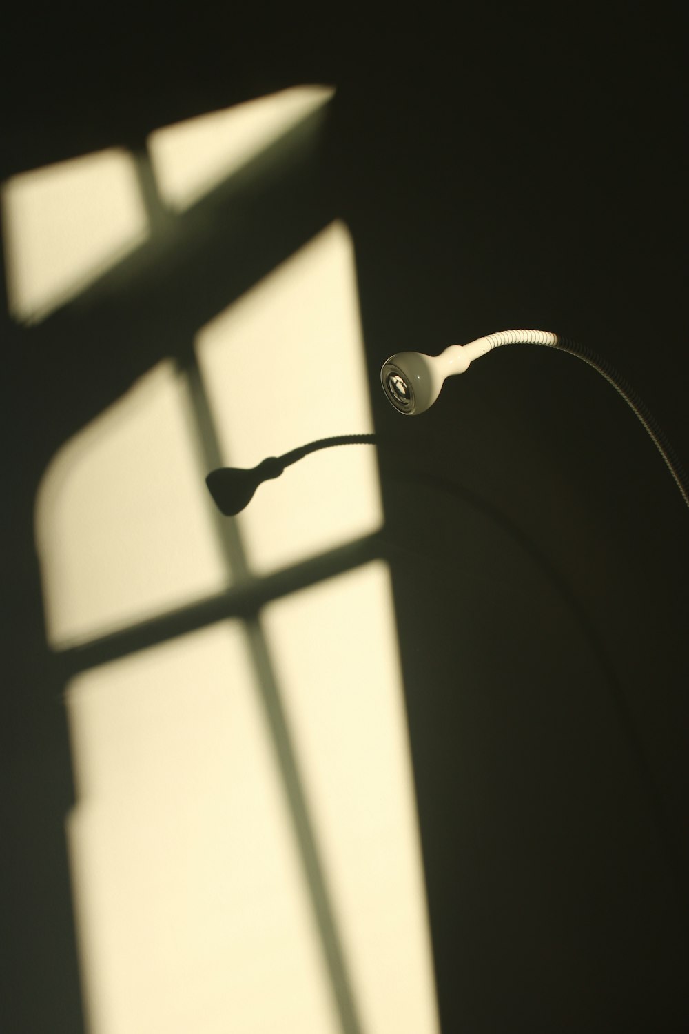 white earbuds on black surface