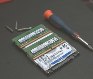 green and silver hard disk drive