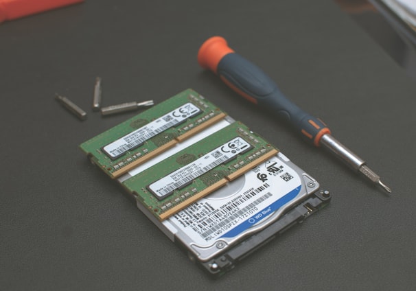 green and silver hard disk drive