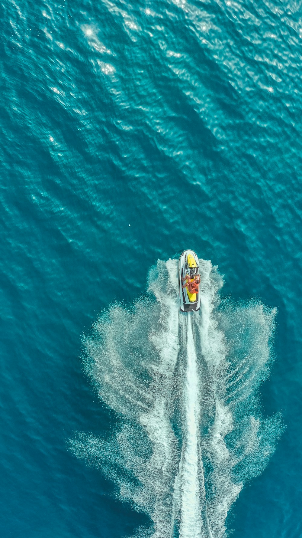 person surfing on blue sea during daytime