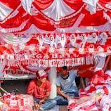 Karang Taruna Pregas members preparing decorations for a neighborhood celebration
