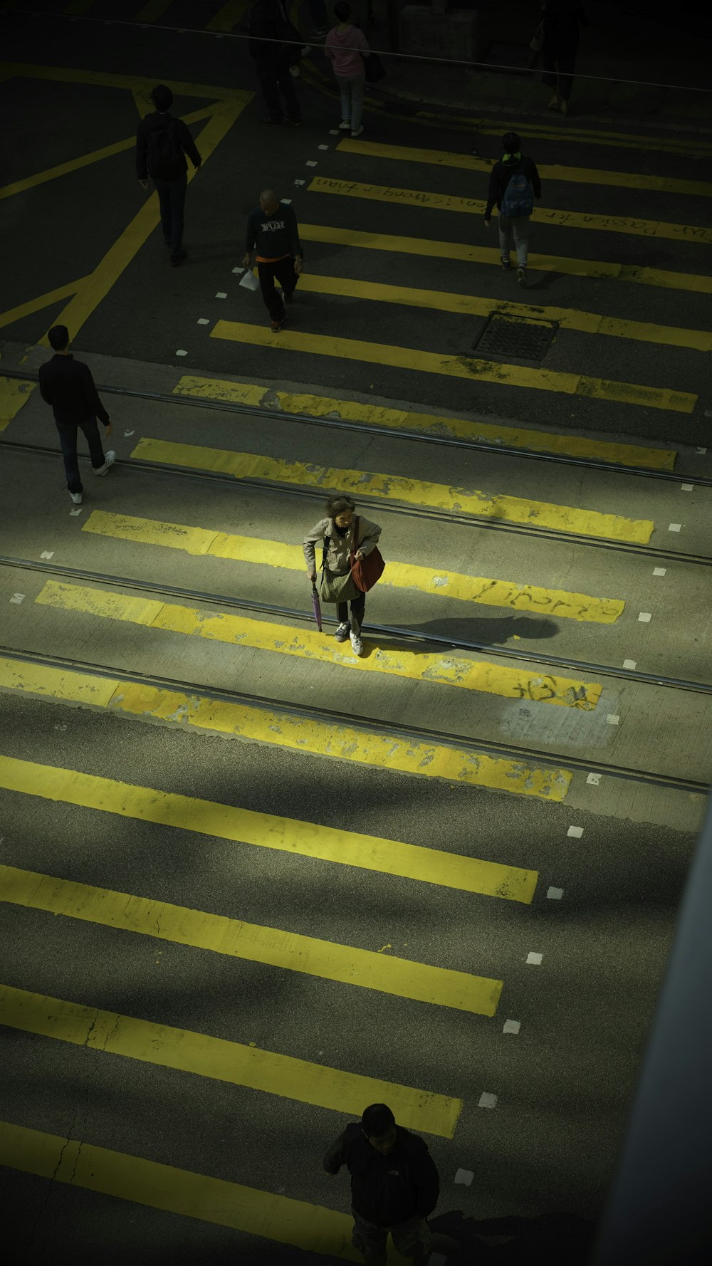 2 person walking on pedestrian lane