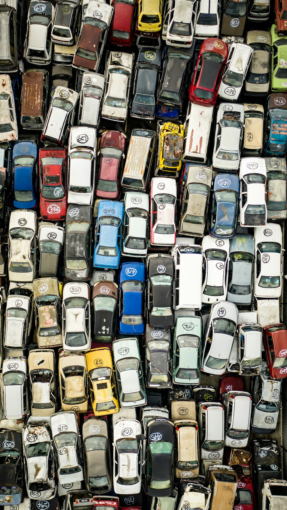 assorted cars parked on parking lot during daytime