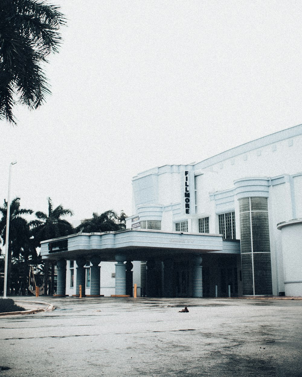 an empty parking lot in front of a building