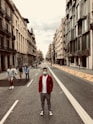 people walking on street between buildings during daytime