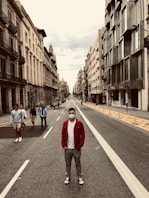 people walking on street between buildings during daytime