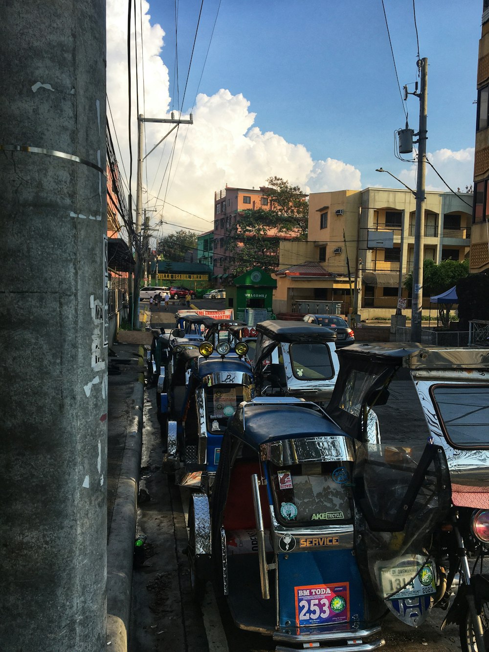 cars parked on side of the road during daytime