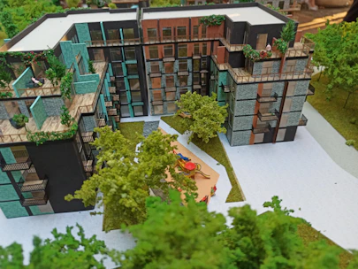 Close-up of a detailed architectural scale model showcasing a modern residential complex.