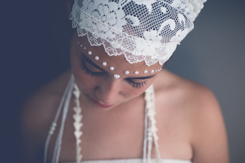 woman wearing white floral headband