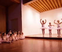 group of people dancing on brown wooden floor