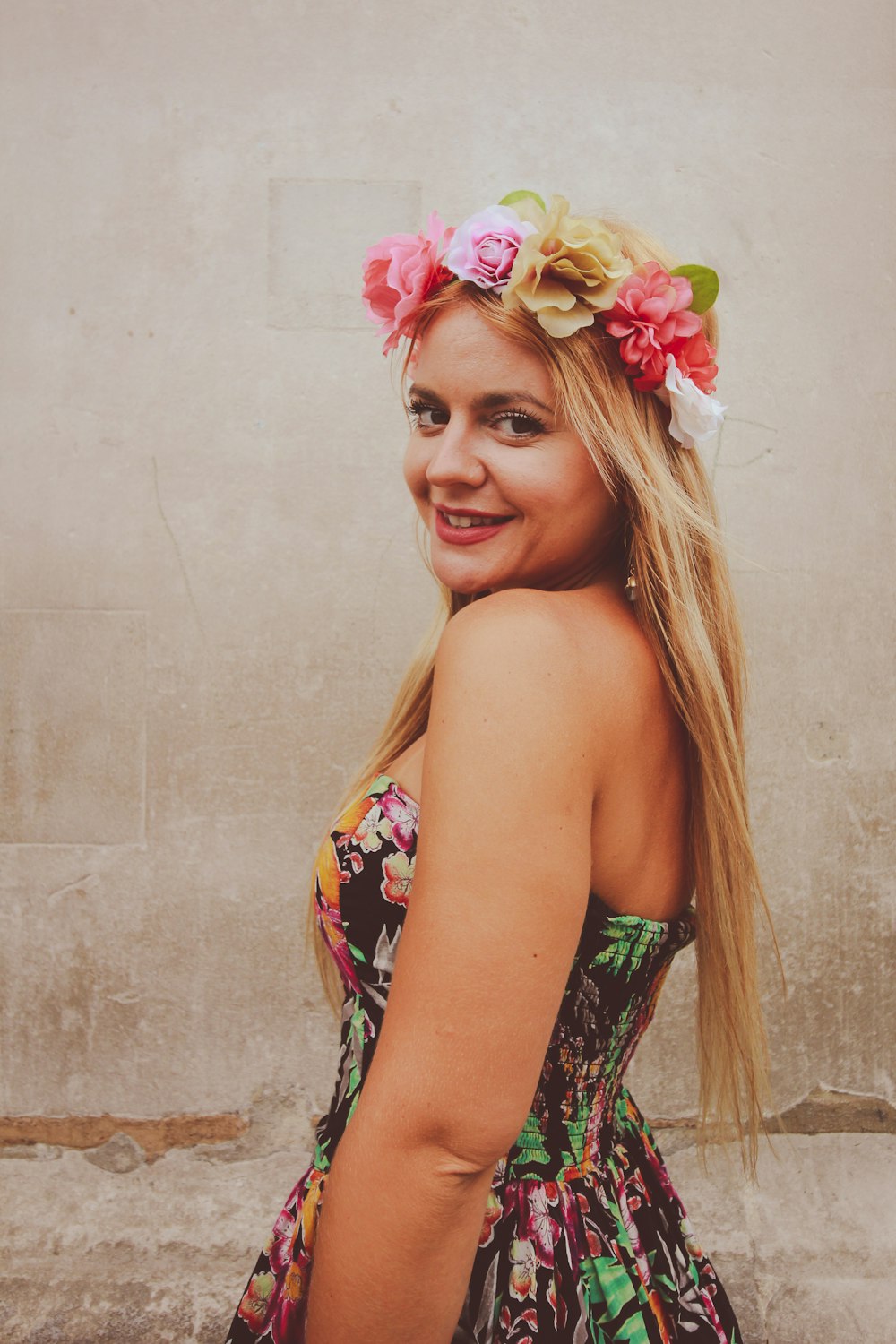 woman in black and red floral tube top with flower headband