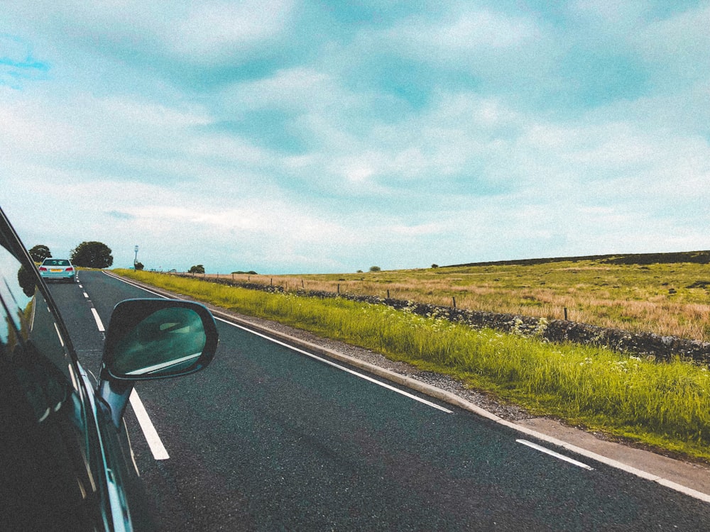 black car on road during daytime