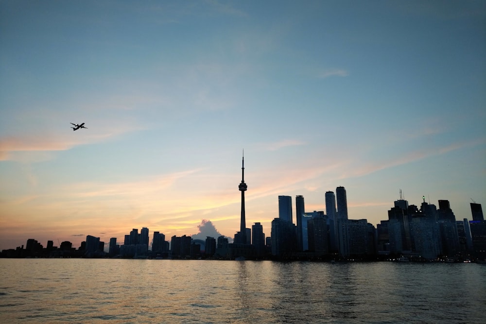 city skyline across body of water during daytime