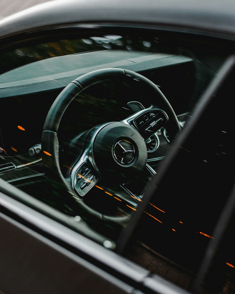 black and silver steering wheel