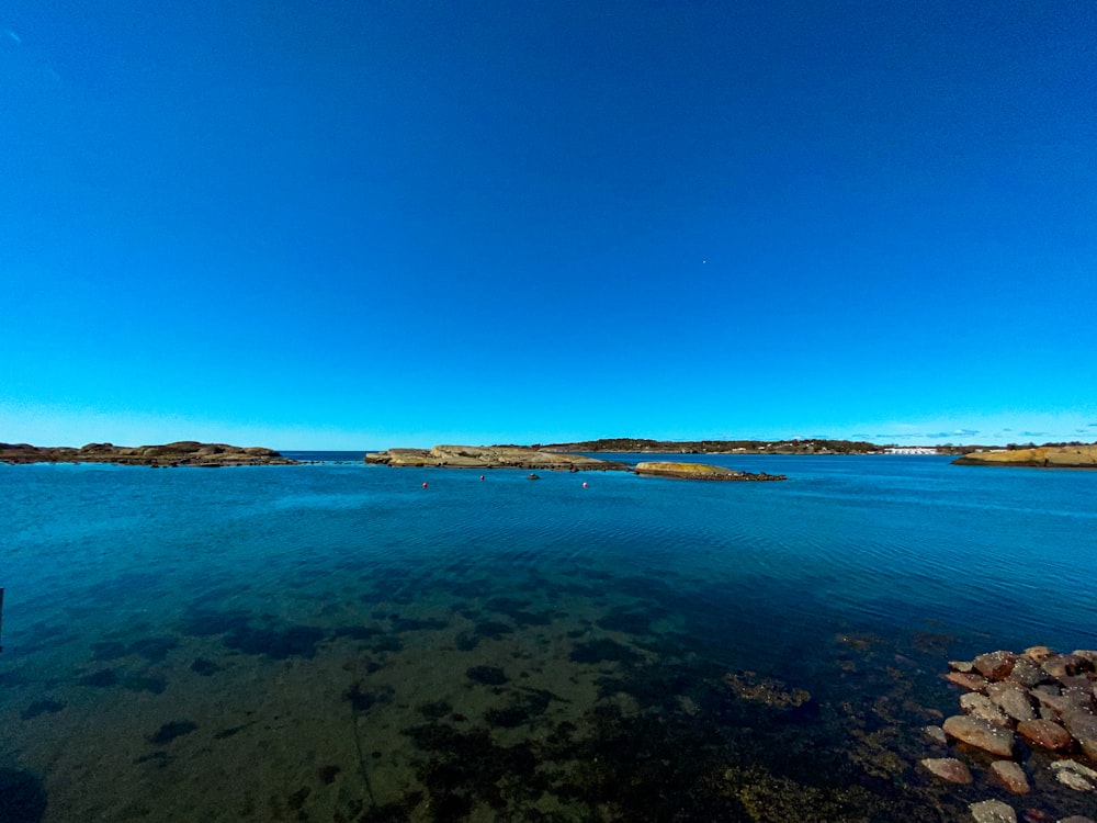 blue sea under blue sky during daytime