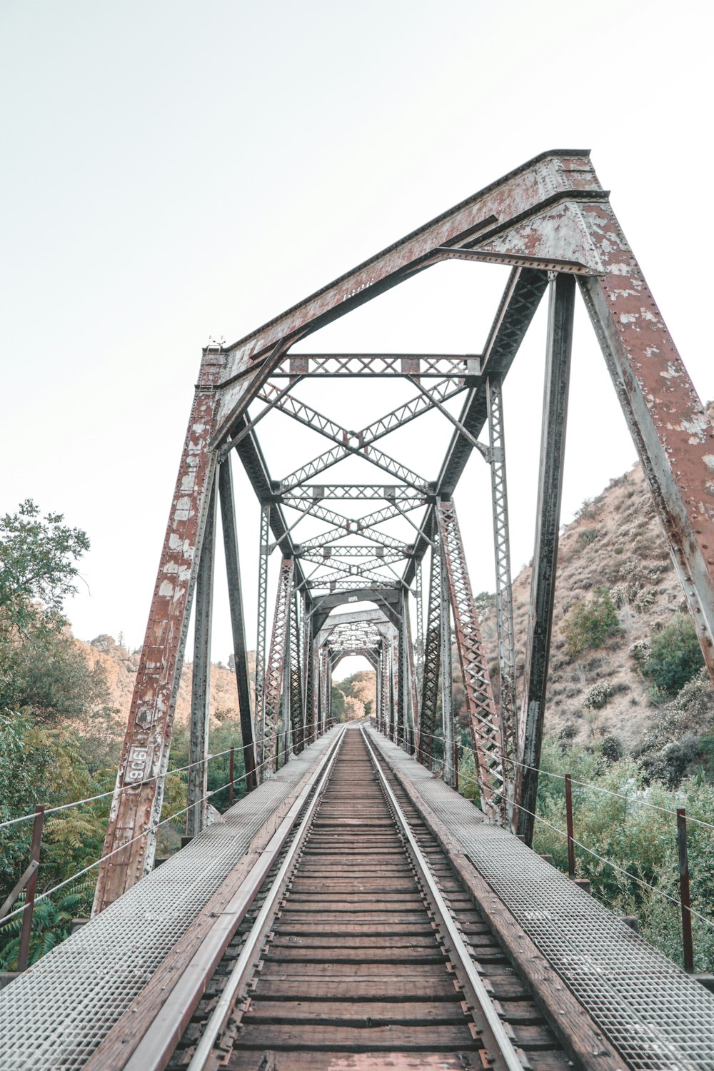 brown wooden bridge over river