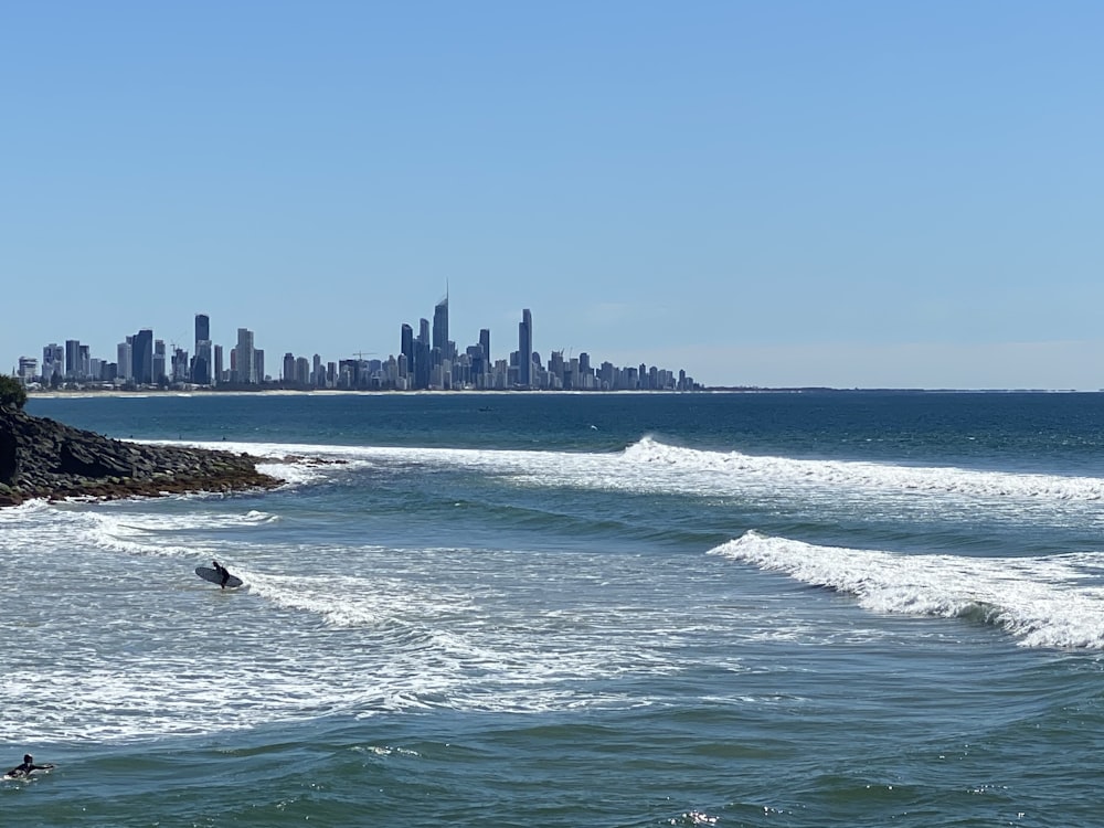 sea waves crashing on shore during daytime