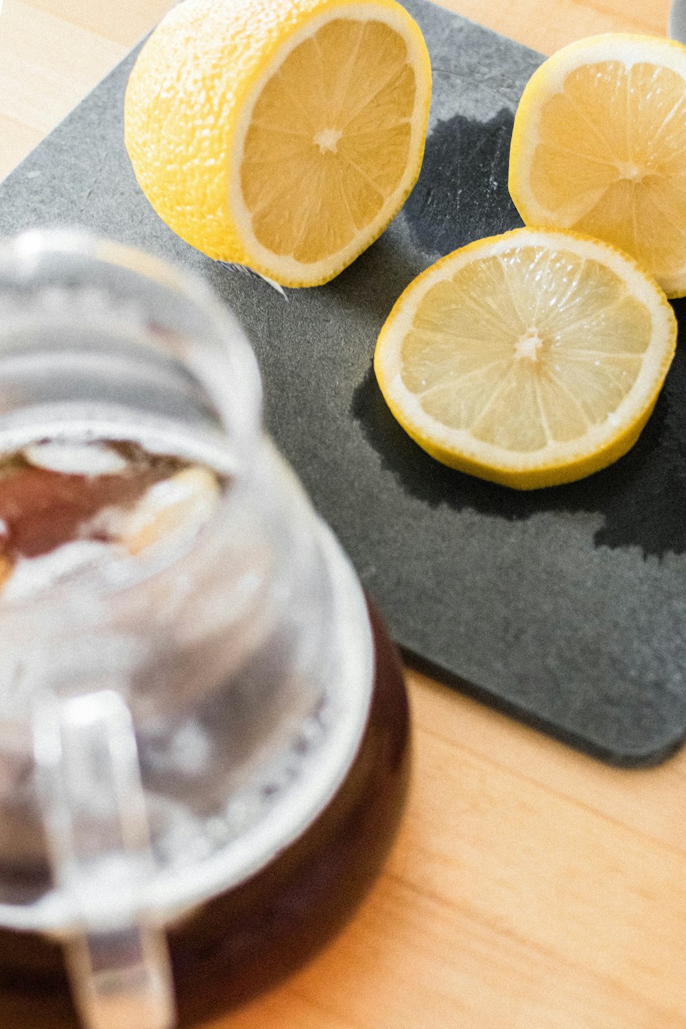 clear drinking glass with brown liquid