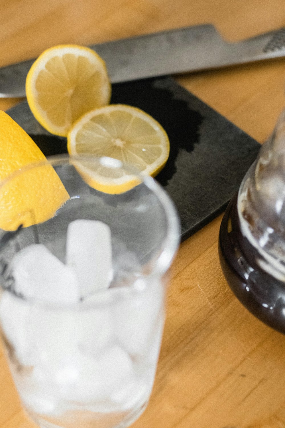 sliced lemon on clear glass jar