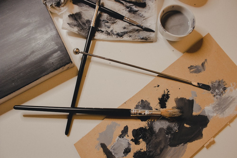 black and white painting on white wooden table