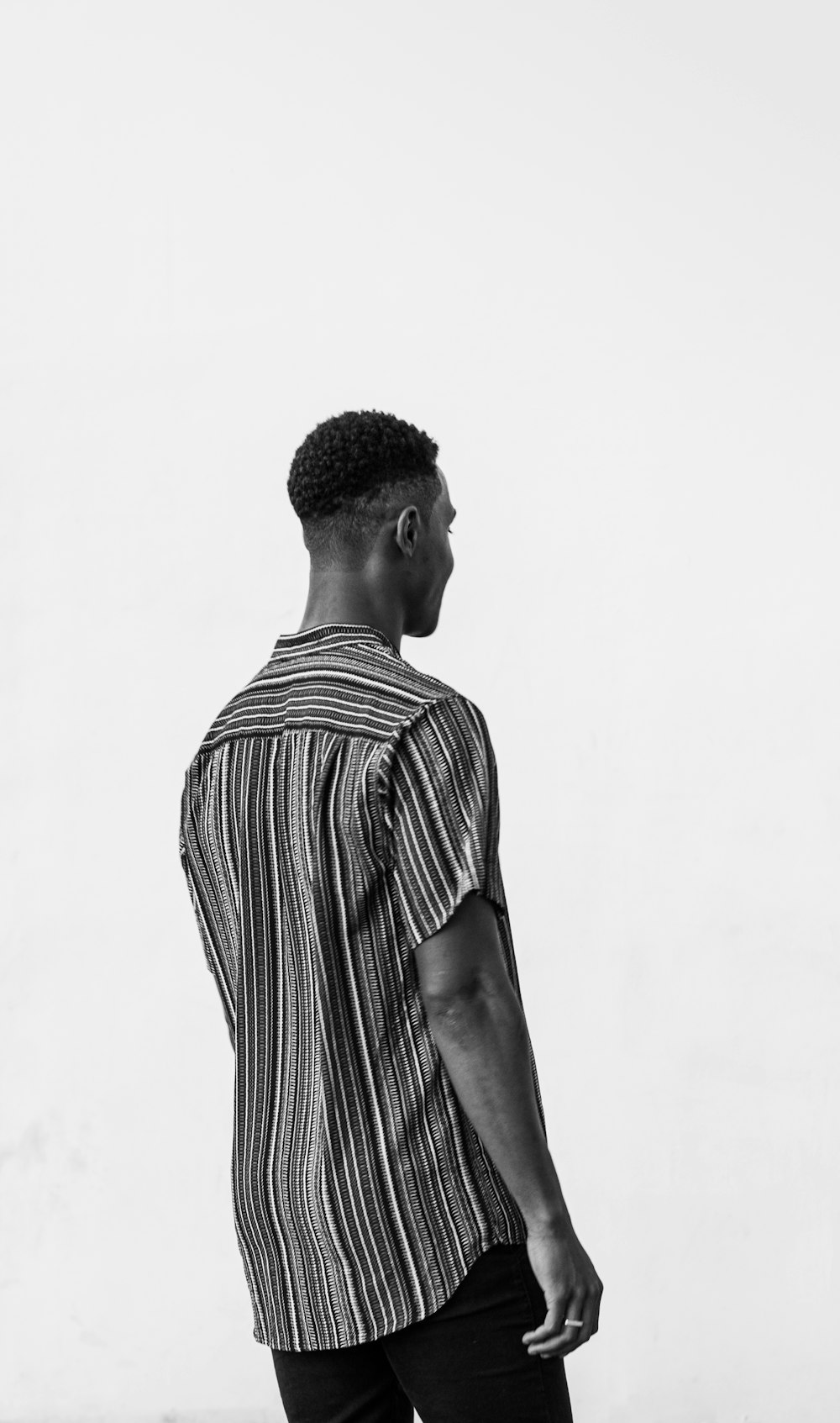man in black and white stripe shirt